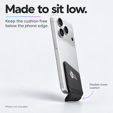 Black PinkyPillow attached low on the back of a silver phone